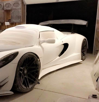 Illustration for article titled Praise All That Is Unholy: Here's A BMW V10 Swapped Into A Lotus Elise